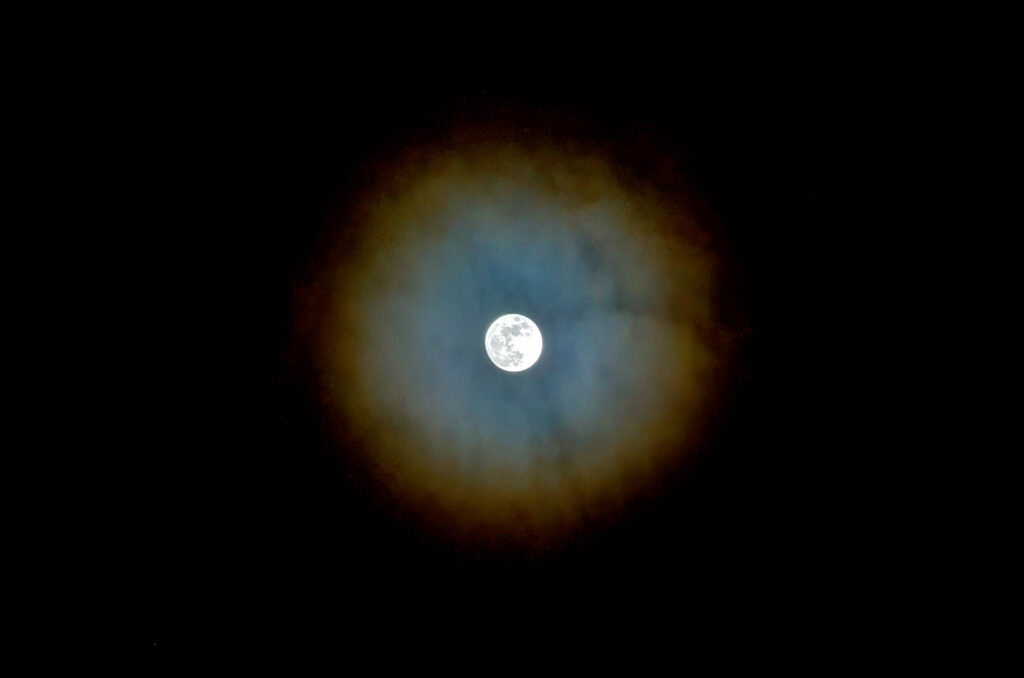 Full moon with colorful halo effect