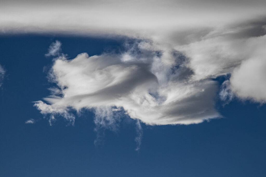 Fluffy white clouds against blue sky