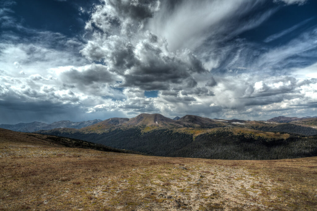 Mountain landscape with dramatic cloud formations.