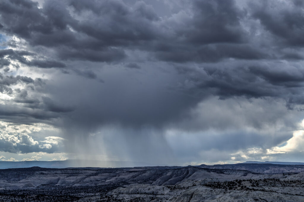 Storm clouds over rugged mountain landscape