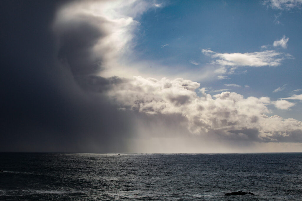 Dramatic ocean storm with dark clouds approaching.