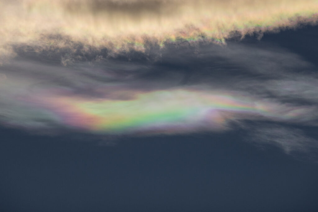 Rainbow colors in cloudy sky